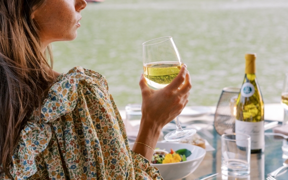 Woman eating by lake