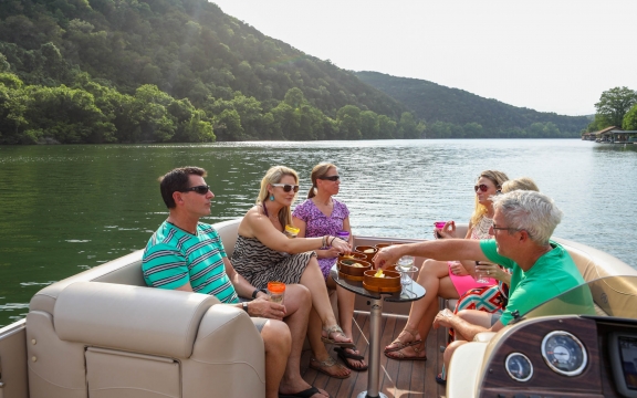 Six people having a good time with the boat cruise experience
