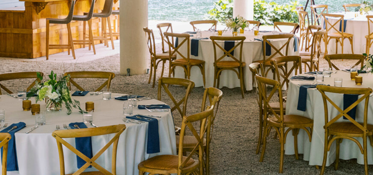 Tables and chairs are arranged for a group event at the Lake Lounge